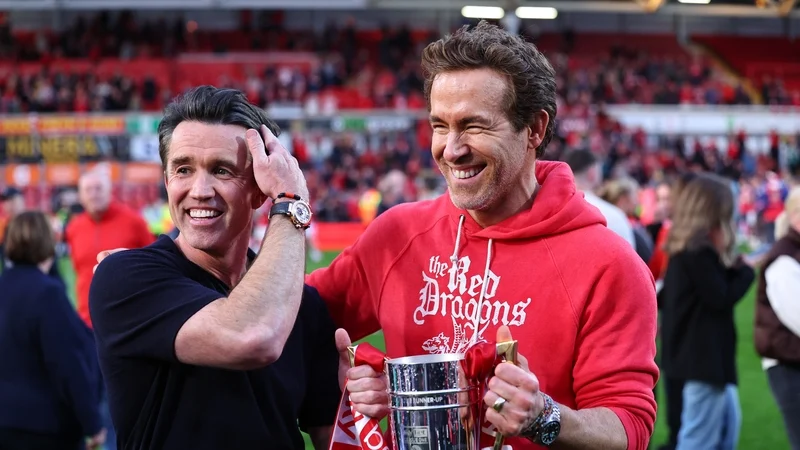 Hollywood stars Ryan Reynolds and Rob McElhenney celebrate Wrexham promotion