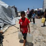 60 killed in Gaza attacks, many near aid site - medics