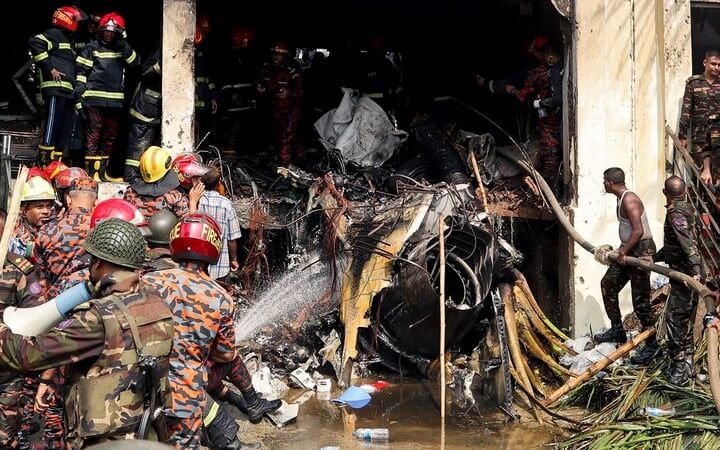 At least 19 killed as Bangladeshi air force jet crashes into college campus