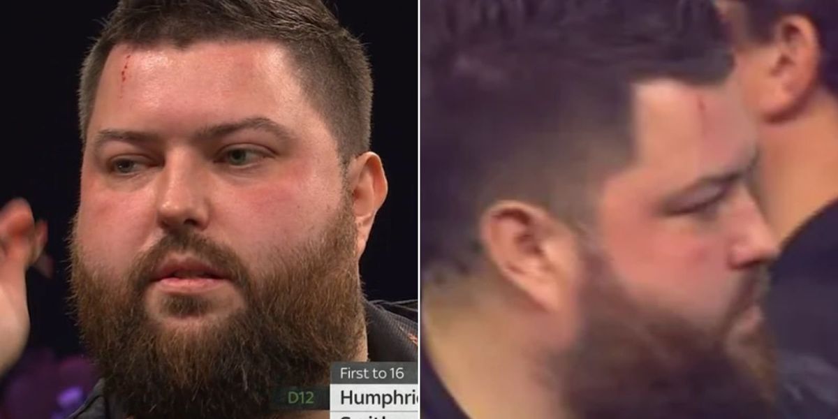 Michael Smith injures forehead during Grand Slam of Darts match against Luke Humphries