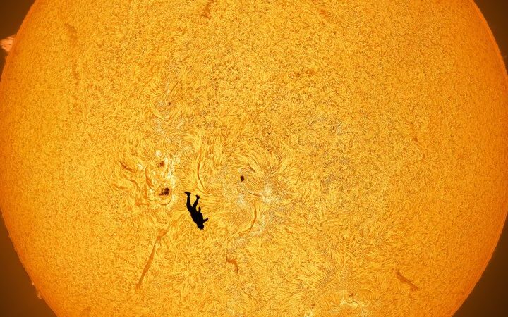 Astrophotographer captures stunning image of skydiver against the sun in Arizona