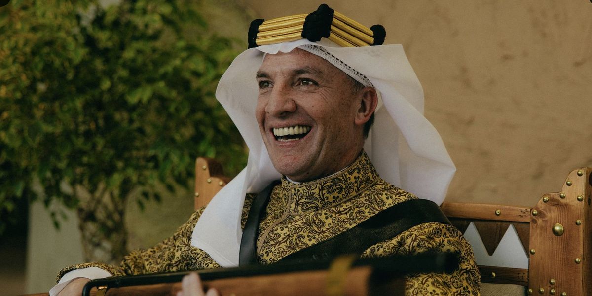 Brendan Rodgers sparks reactions in Saudi Arabia wearing traditional attire and holding a rifle