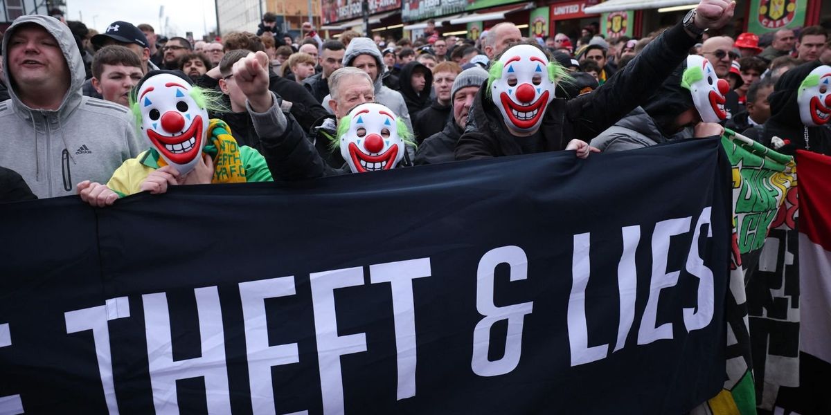 Manchester United supporters protest outside Old Trafford, demanding urgent changes from club ownership