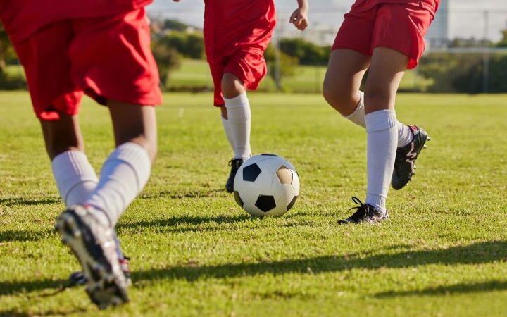 NFL evaluates grass versus turf for improved safety and performance in youth sports