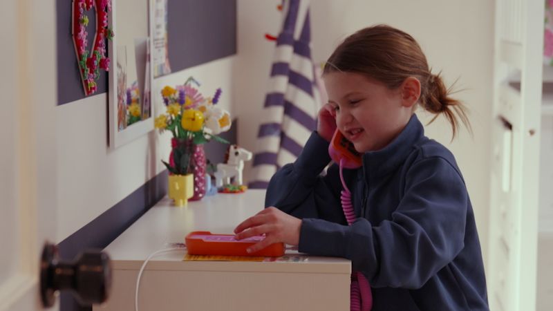 Young children embrace landlines, sparking nostalgia and joy among parents
