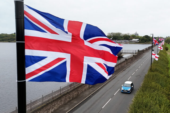 Government strategy links national flags to hate symbols, raising concerns over community cohesion