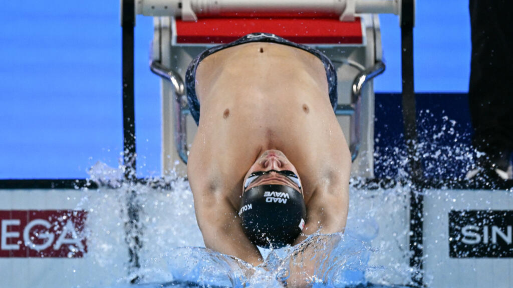 Swimming’s governing body lifts flag ban on Russian athletes, diverging from Olympic guidance