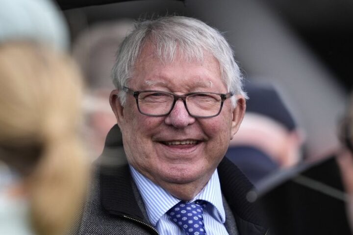 Alex Ferguson celebrates Wade Out's victory at Aintree on Grand National day