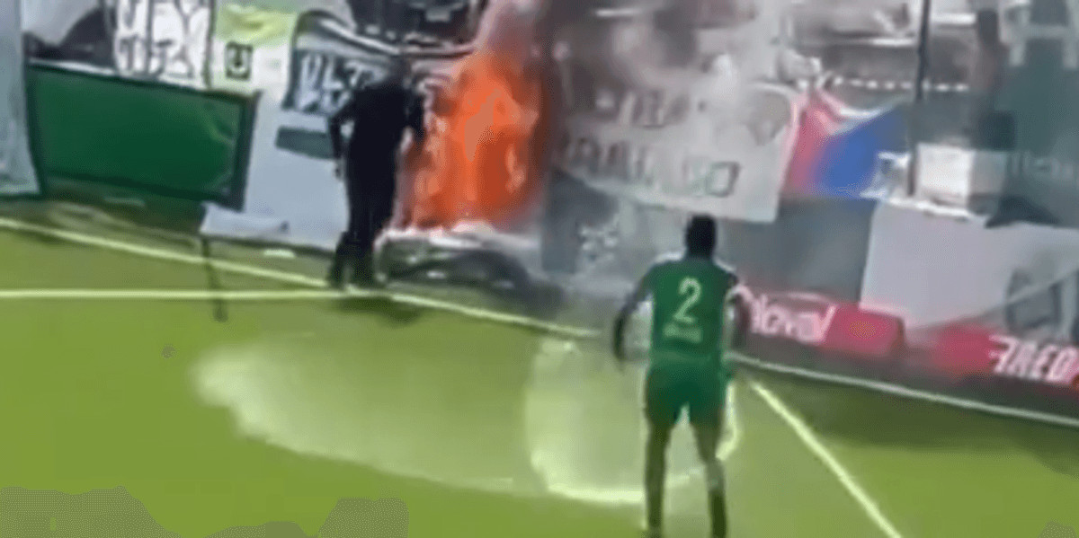 Ezequiel Schelotto extinguishes fire during match at FC Paradiso stadium