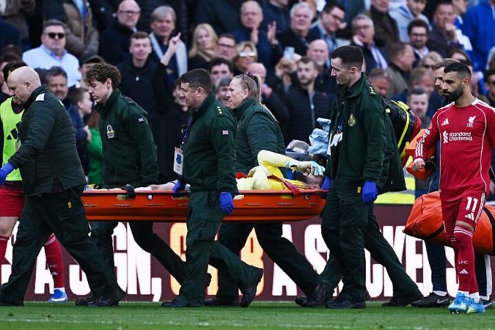 Liverpool goalkeeper stretchered off during Merseyside derby, third-choice keeper brought on