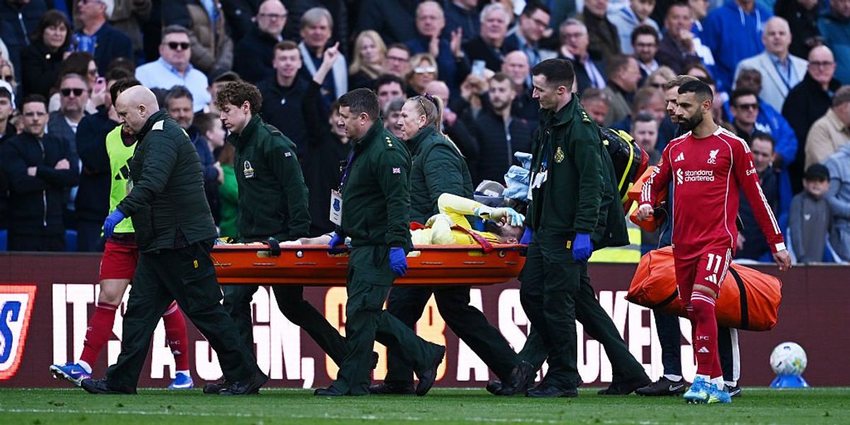 Liverpool goalkeeper stretchered off during Merseyside derby, third-choice keeper brought on