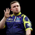 Luke Littler reacts to Gian van Veen after Premier League darts clash