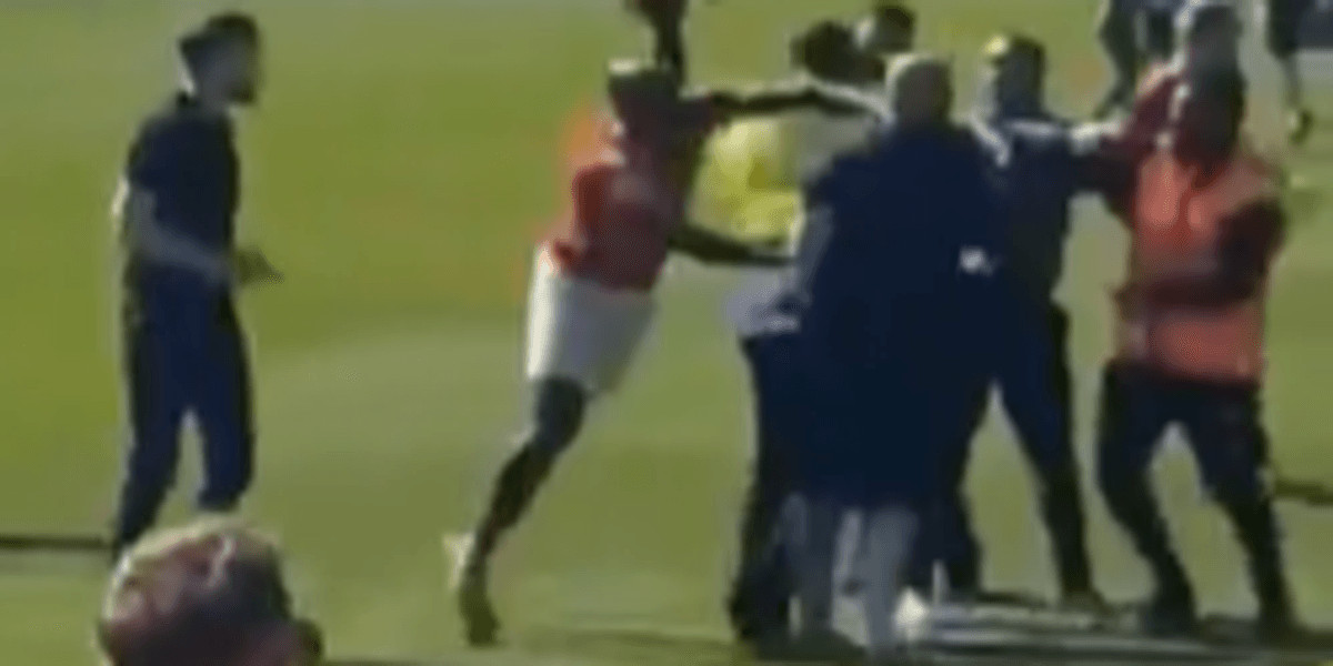 Police investigate incident as York City player appears to punch Rochdale fan during pitch invasion