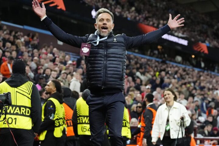 Lee Hendrie restrained by stewards after taunting Nottingham Forest fans during Villa's victory