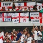 England fans obscure flag design during World Cup match against Ghana after FIFA ruling