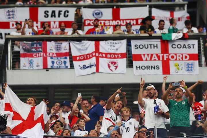 England fans obscure flag design during World Cup match against Ghana after FIFA ruling