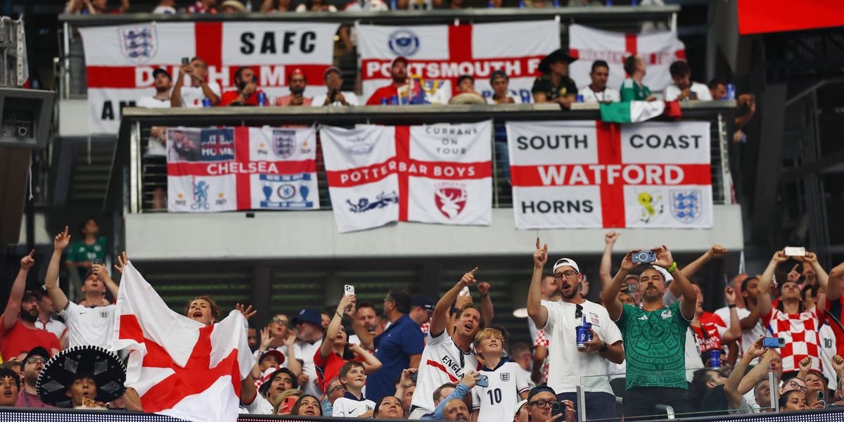 England fans obscure flag design during World Cup match against Ghana after FIFA ruling