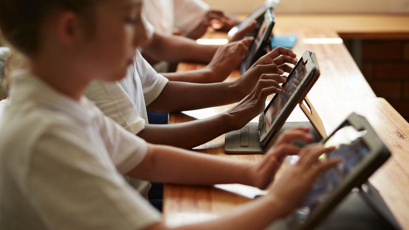 Schools encourage screen reduction at home while promoting technology use in classrooms