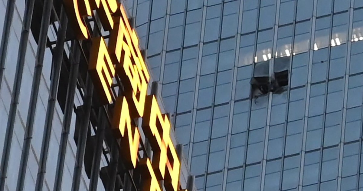 China identifies pilot killed in crash into country's tallest building