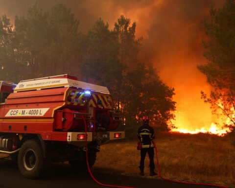 Macron visits wildfire battleground in France, pledges to support fire crews