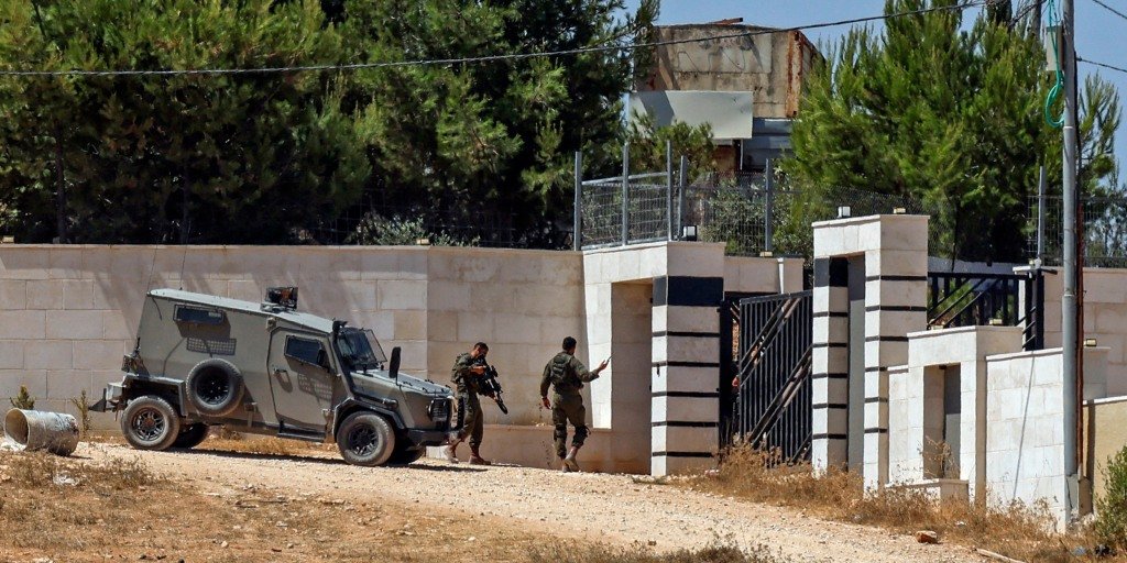 Escalating standoff in West Bank as settlers surround Palestinian families