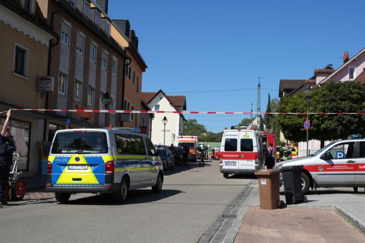 German police evacuate buildings as they investigate potentially explosive device on rail tracks