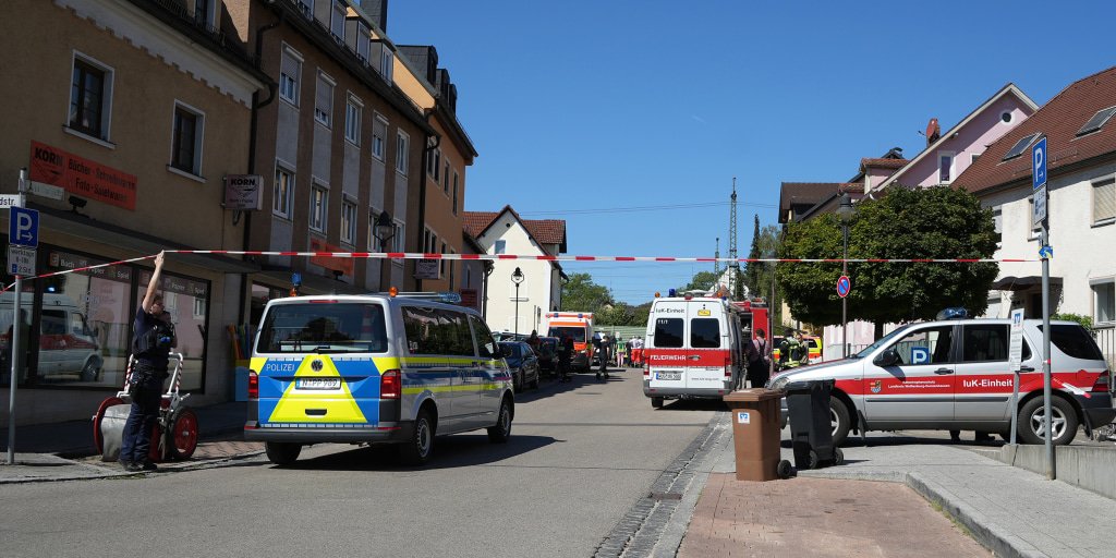 German police evacuate buildings as they investigate potentially explosive device on rail tracks