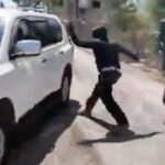 Masked Israeli settlers attack Palestinian woman and NBC News team in West Bank