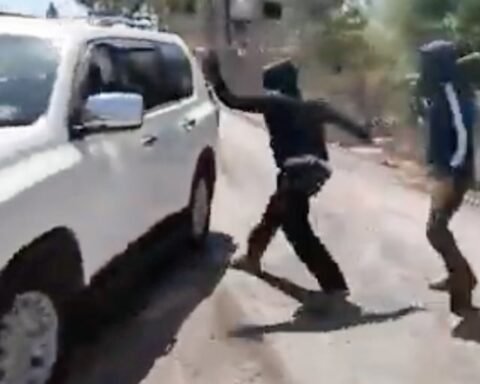 Masked Israeli settlers attack Palestinian woman and NBC News team in West Bank