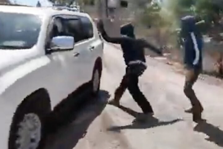 Masked Israeli settlers attack Palestinian woman and NBC News team in West Bank