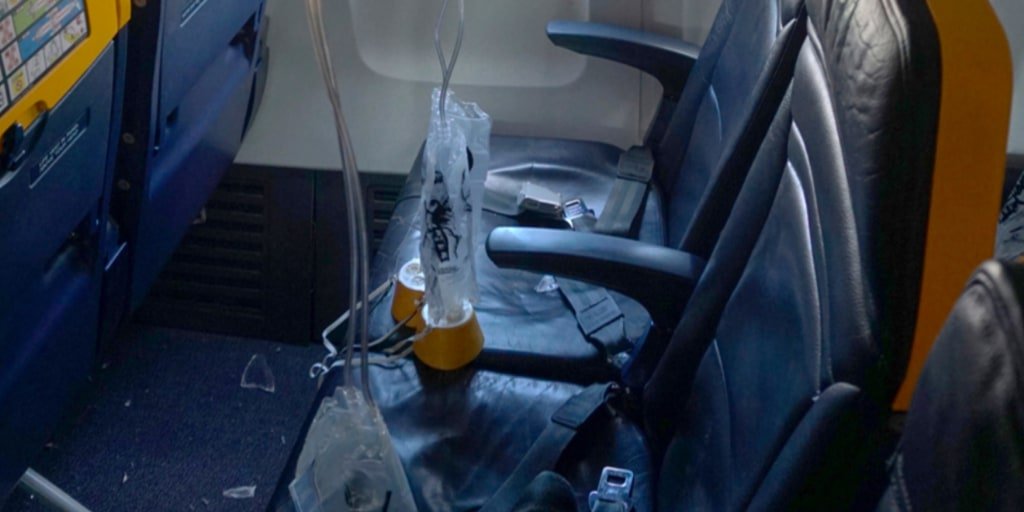 Ryanair flight window shattered by engine part, man nearly sucked out during incident