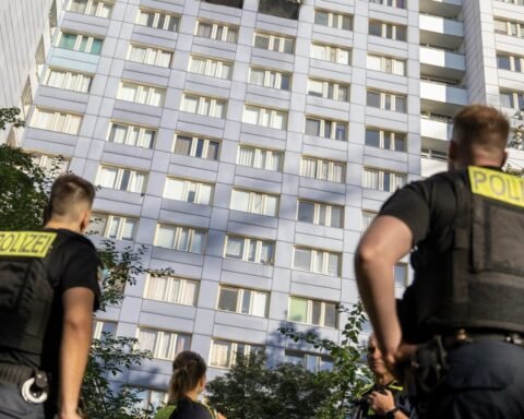 Woman leaps from burning Berlin high-rise to safety in dramatic rescue