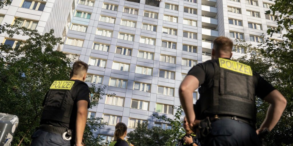 Woman leaps from burning Berlin high-rise to safety in dramatic rescue