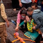 Mourners in Nepal conduct symbolic cremations for loved ones missing after devastating floods