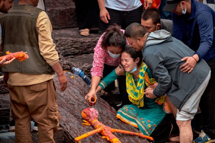 Mourners in Nepal conduct symbolic cremations for loved ones missing after devastating floods