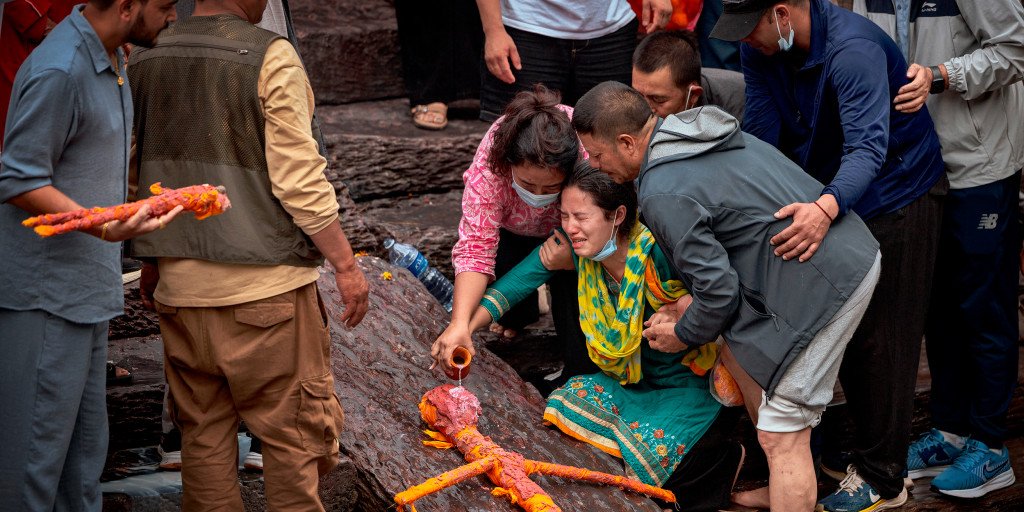 Mourners in Nepal conduct symbolic cremations for loved ones missing after devastating floods