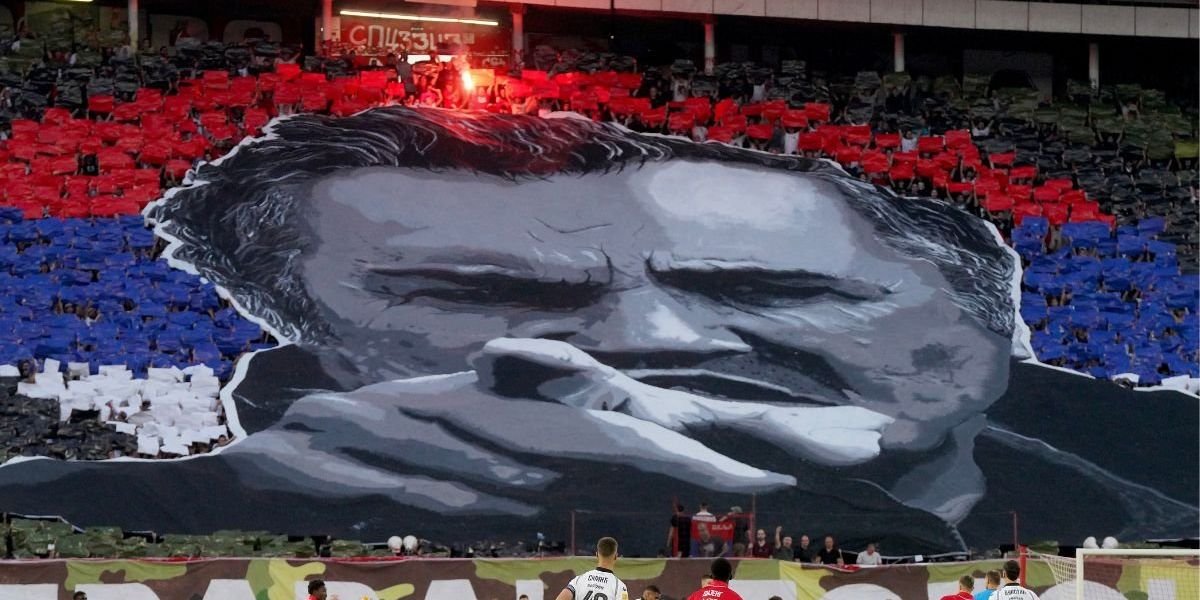 Red Star fans display tifo of convicted war criminal Ratko Mladic before derby match