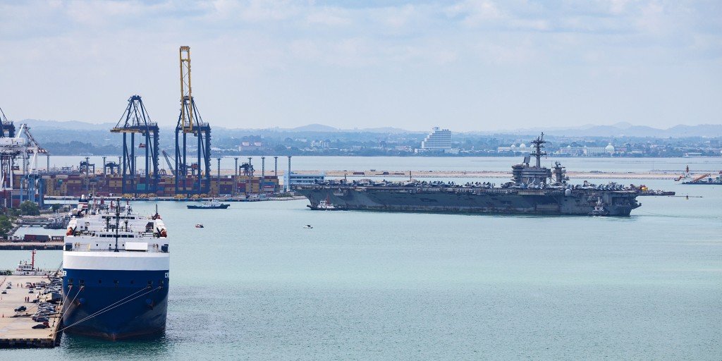USS Abraham Lincoln docks in Thailand after lengthy deployment in the Middle East