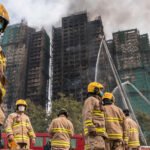 Hong Kong leader apologizes for deadly fire amid criticism of construction practices
