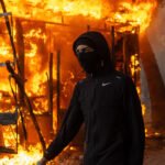 Police detain 1,800 as protests in France escalate with violence and looting