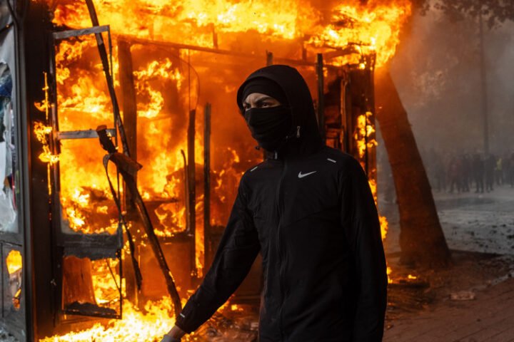 Police detain 1,800 as protests in France escalate with violence and looting